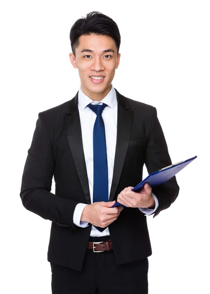 Businessman holding  clipboard — Stock Photo, Image