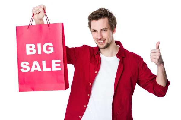 Homem feliz fazendo compras com o polegar para cima — Fotografia de Stock