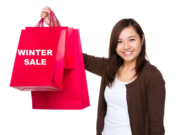 Mujer sosteniendo con bolsas de compras —  Fotos de Stock