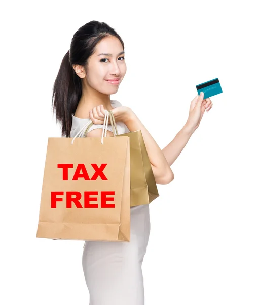 Woman holding credit card and bags — Stock Photo, Image