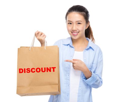 Asian young woman with shopping bags clipart