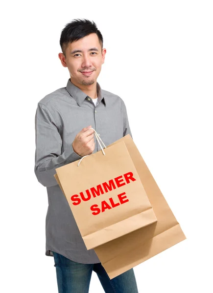 Asian handsome man with shopping bags — Stock Photo, Image