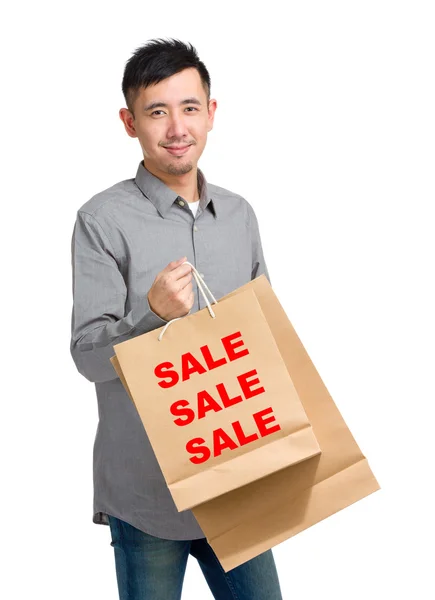 Asian handsome man with shopping bags — Stock Photo, Image