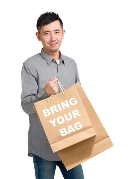 Asian handsome man with shopping bags — Stock Photo, Image