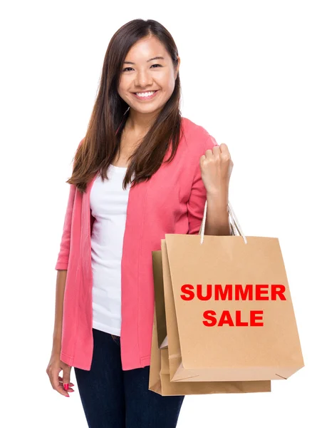 Happy asian woman with shopping bags — Stock Photo, Image