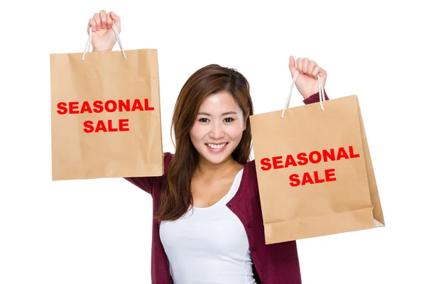 Asian woman raise up the shopping bags — Stock Photo, Image