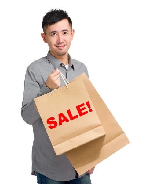 Asian handsome man with shopping bags — Stock Photo, Image