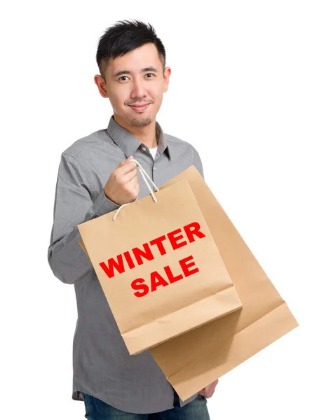 Asiático bonito homem com sacos de compras — Fotografia de Stock
