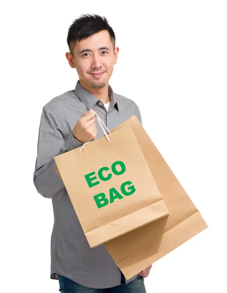 Asiático guapo hombre con compras bolsas — Foto de Stock