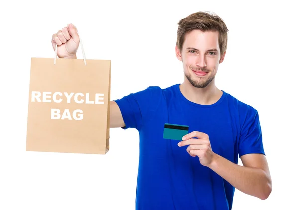 Man with shopping bag and credit card — Stock Photo, Image