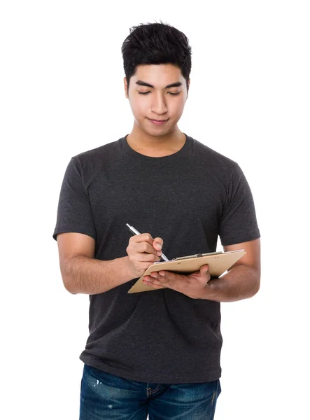 Asian young man in brown t-shirt — Stock Photo, Image