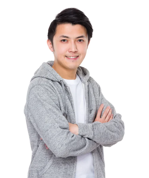 Aziatische jonge man in grijs hoodie — Stockfoto