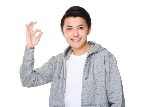 Asian young man in grey hoodie — Stock Photo, Image