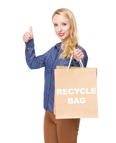 Woman with shopping bags and thumb up — Stock Photo, Image
