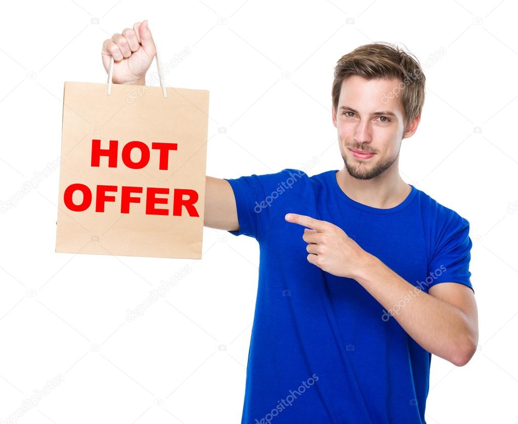 Man with finger point to the shopping bag