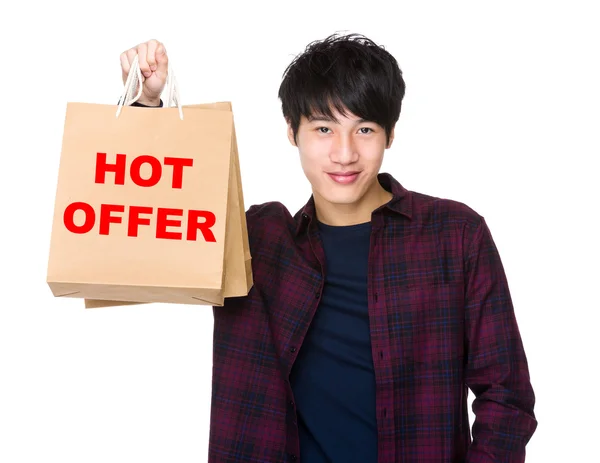Asian man holding shopping bags — Stock Photo, Image
