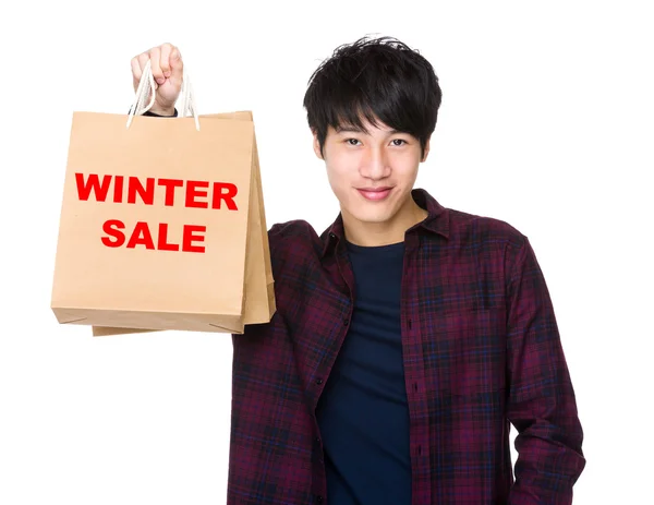 Asian man holding shopping bags — Stock Photo, Image