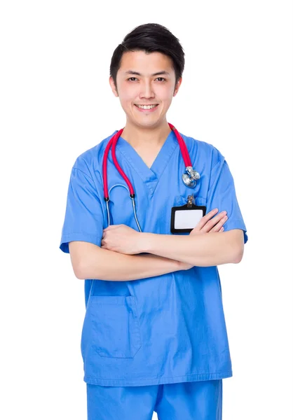 Asiatische junge Arzt in blauer Uniform — Stockfoto