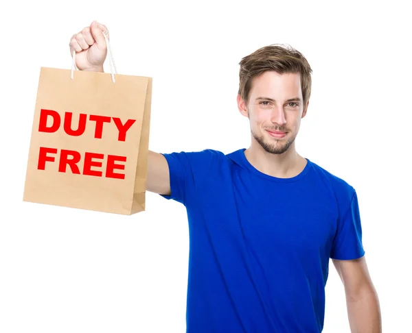 Young handsome man with shopping bag — Stock Photo, Image