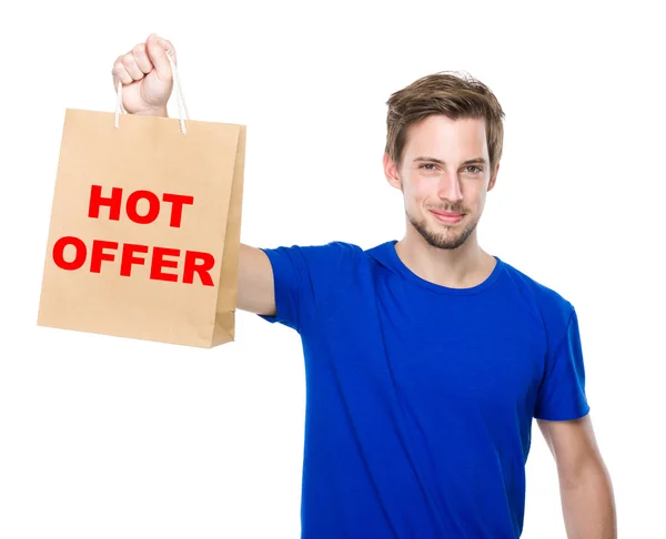 Young handsome man with shopping bag — Stock Photo, Image