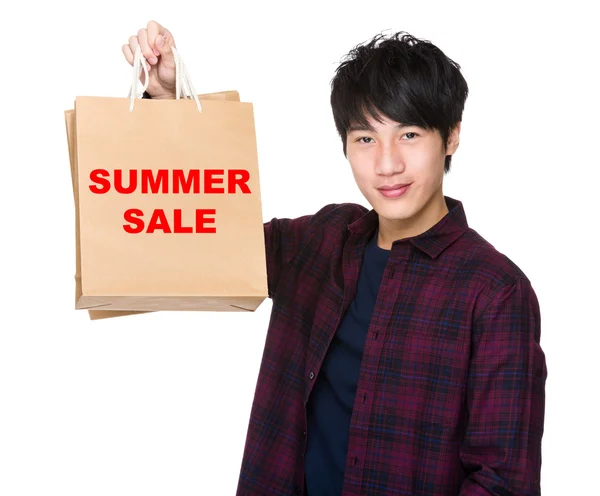 Asian Man holding shopping bags — Stock Photo, Image