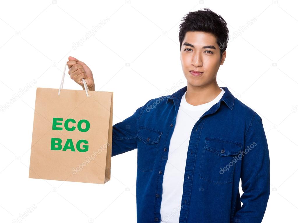 asian young man with shopping bag