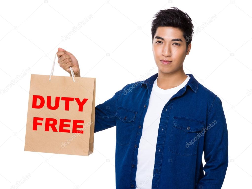 asian young man with shopping bag