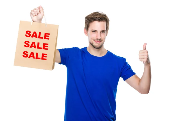 Man with shopping bag and thumb up — Stock Photo, Image