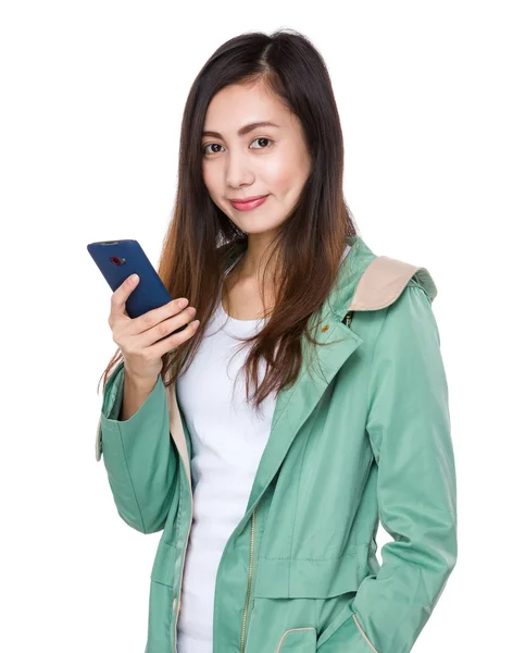 Asian young woman in green coat — Stock Photo, Image