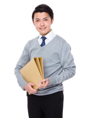 Genç Asyalı işadamı gri süveterli