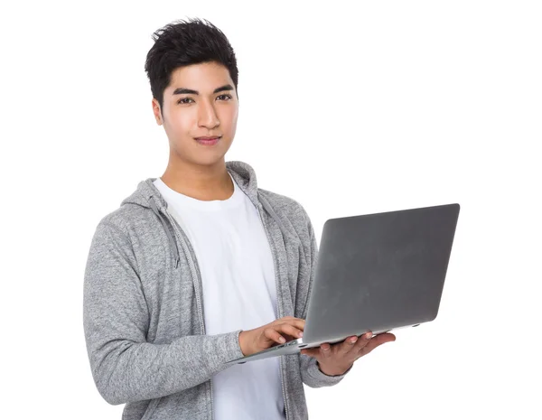 Asian young man in grey sweater — Stock Photo, Image