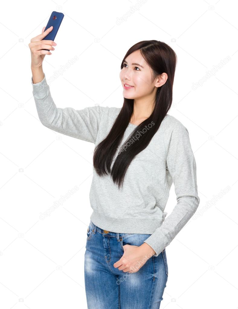 Asian young woman in grey sweater