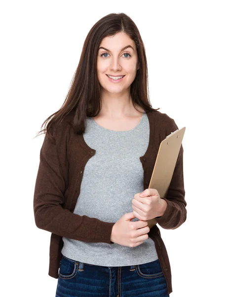 Woman holds clipboard in hands — Stock Photo, Image