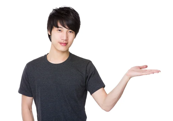 Asian young man in grey t-shirt — Stock Photo, Image