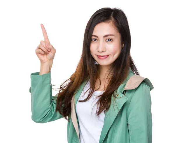 Asian young woman in green coat — Stock Photo, Image