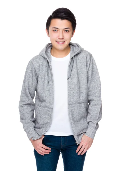 Asijské mladý muž v šedém svetru — Stock fotografie