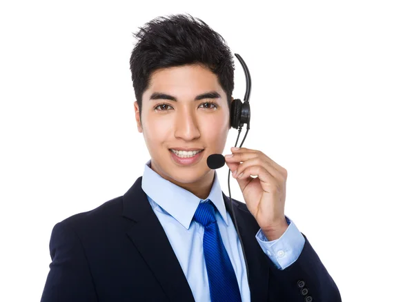 Asiático joven hombre de negocios con auriculares — Foto de Stock