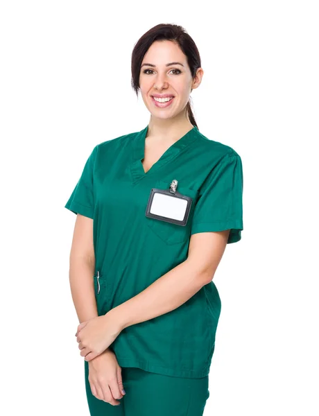 Mladý ženský lékař v zelené uniformě — Stock fotografie