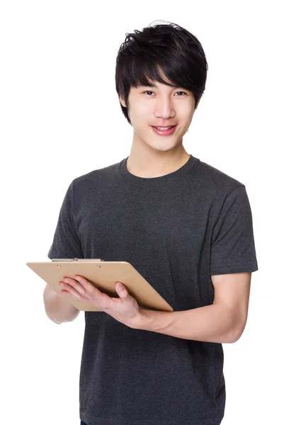 Asijské mladý muž v šedivé tričko — Stock fotografie