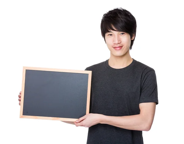 Asian young man in grey t-shirt — Stock Photo, Image