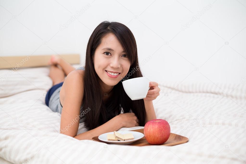 woman having the morning breakfast in bed