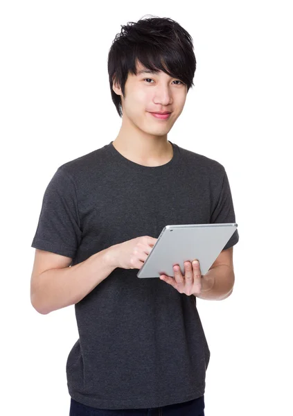 Asian young man in grey t-shirt — Stock Photo, Image