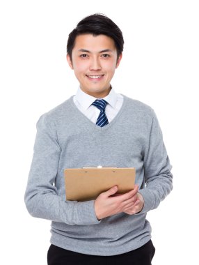 Genç Asyalı işadamı gri süveterli