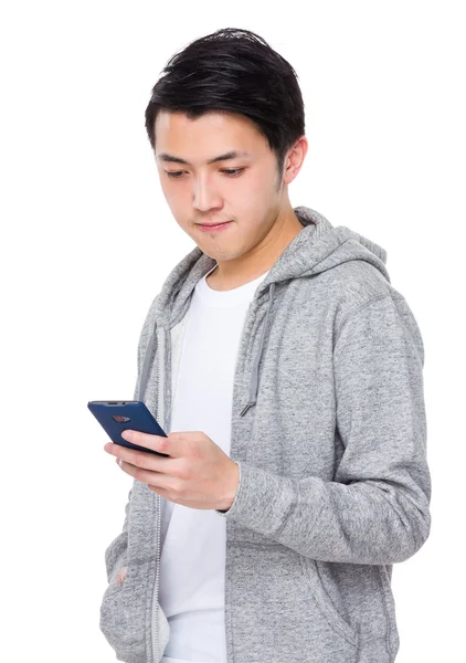 Young asian man in grey hoodie — Stock Photo, Image