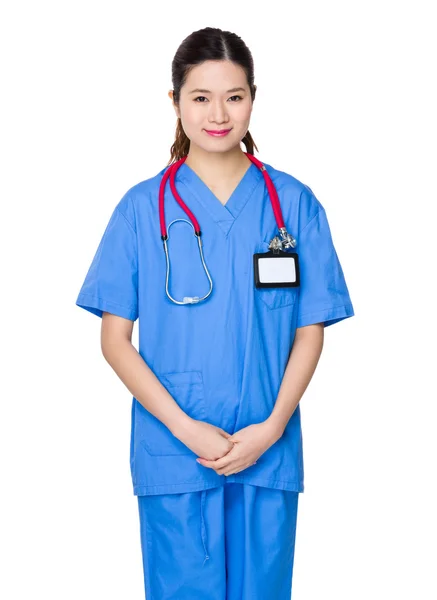Azjatycki kobiece kobieta lekarz w niebieskim mundurze — Zdjęcie stockowe