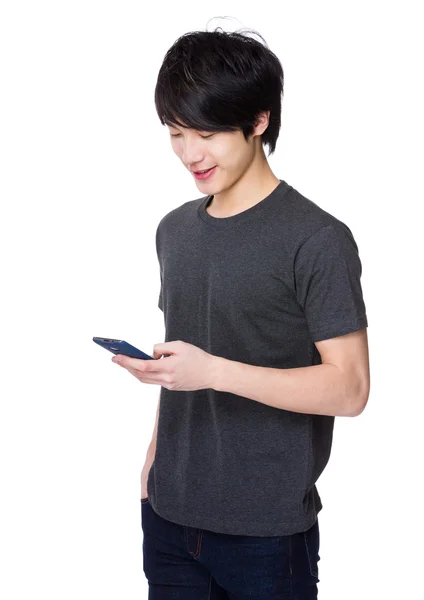 Asiático joven hombre en gris camiseta —  Fotos de Stock