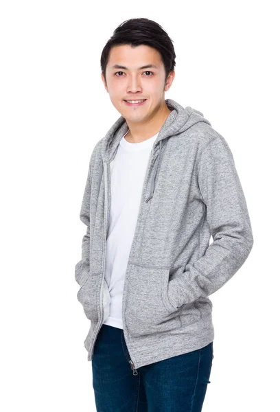 Asian young man in grey sweater — Stock Photo, Image