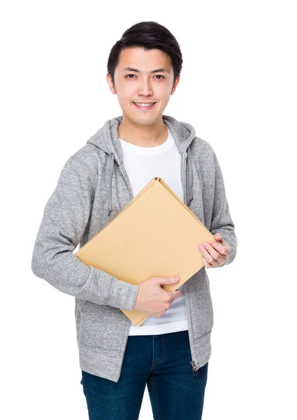 Asian young man in grey sweater — Stock Photo, Image