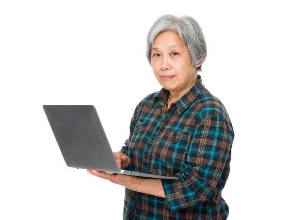 Asian old woman in checkered shirt — Stock Photo, Image
