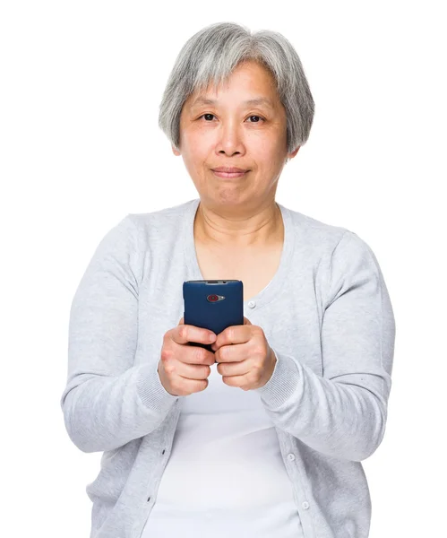 Aziatische oude vrouw in grijze vest — Stockfoto